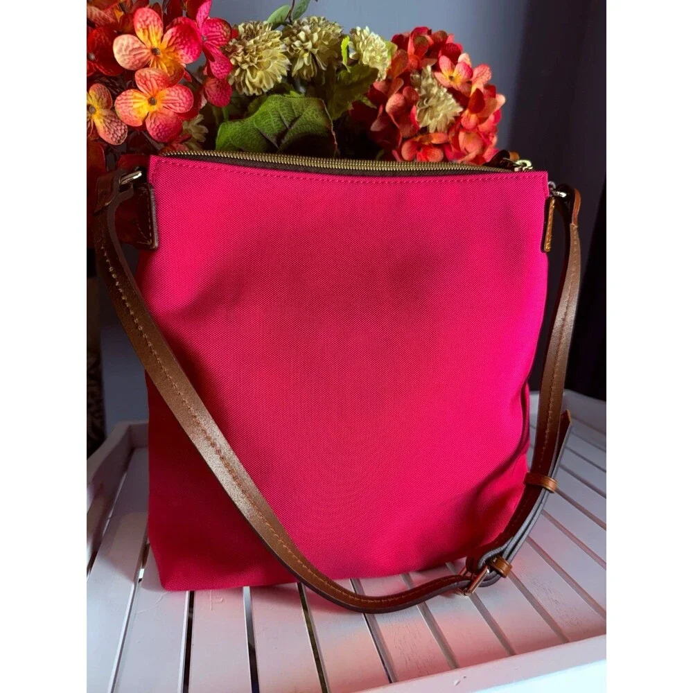 Genuine Dooney and Bourke Zip Crossbody Bag in Hot Pink MSRP $218.00 like new